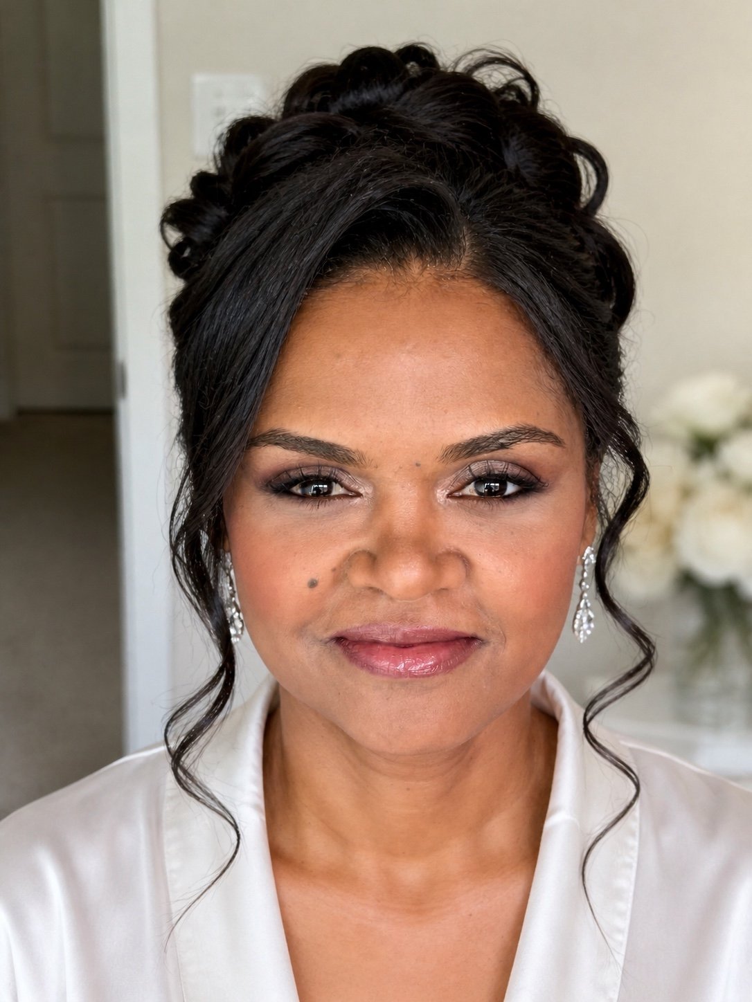 Bride or wedding party member wearing professional bridal makeup by Evolved Beauty