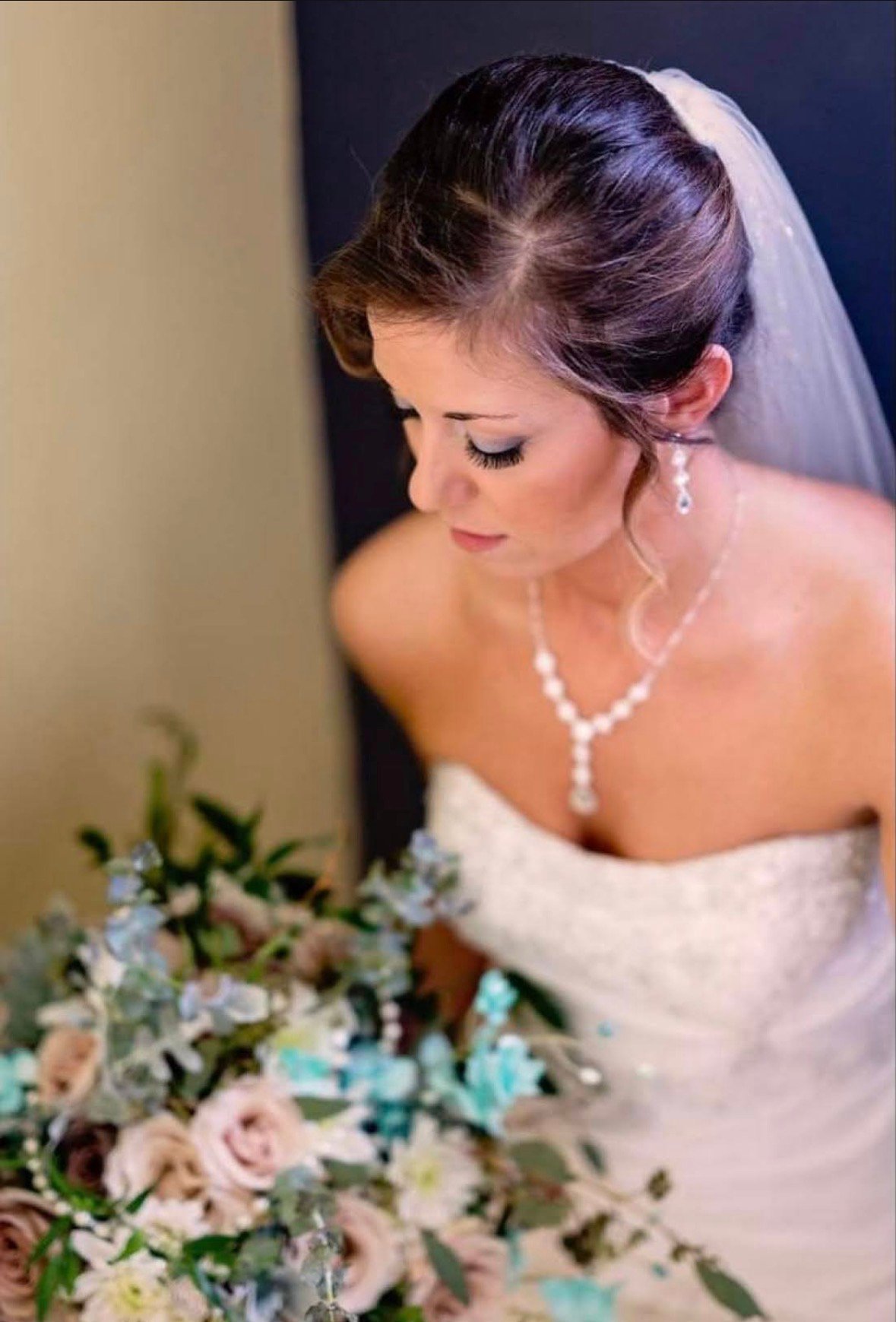 Bride or wedding party member wearing professional bridal makeup by Evolved Beauty